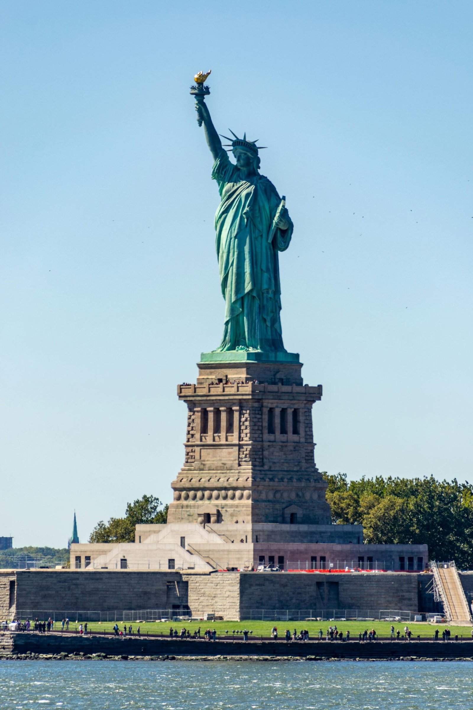 Majestic Statue of Liberty standing tall on a sunny day in New York City.